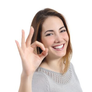 a patient at Rutherford Dental shows her perfect teeth